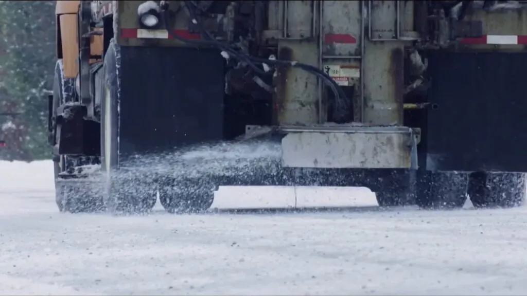 Calcium chloride applied to winter roadway